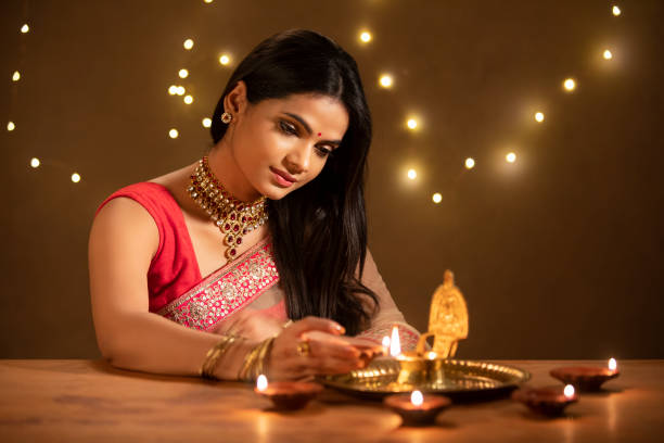 Woman with radiant festive makeup in ethnic outfit.